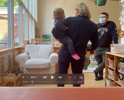 Screenshot from one of the Swivl videos showing a child-caregiver interaction.