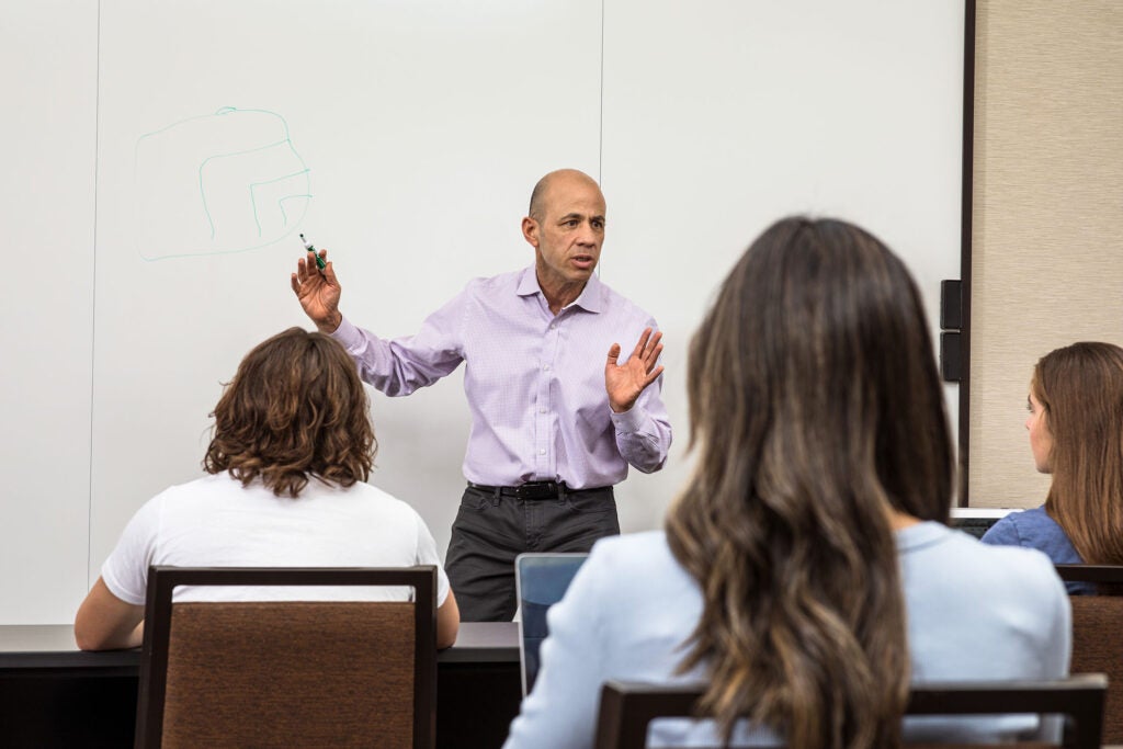 Photo of a professor on campus lecturing