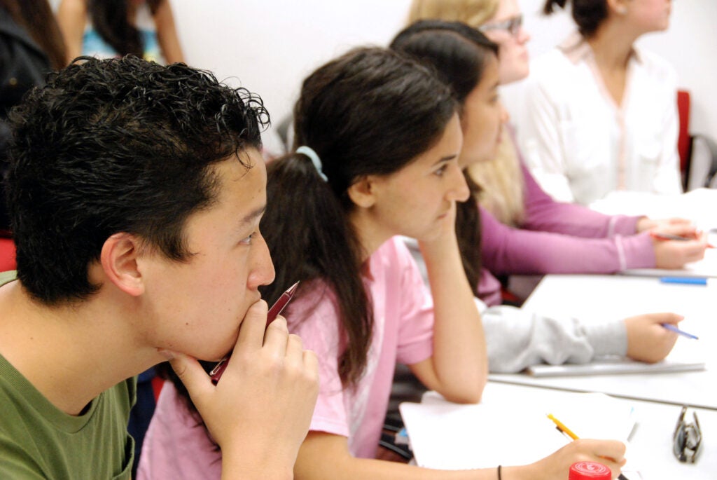 Students looking on in chemistry class