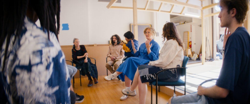 Photo of students in a class discussion