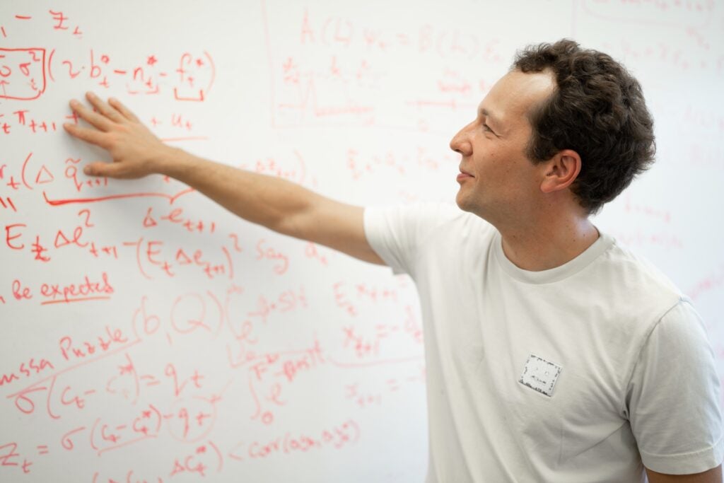 Image of a professor at a whiteboard