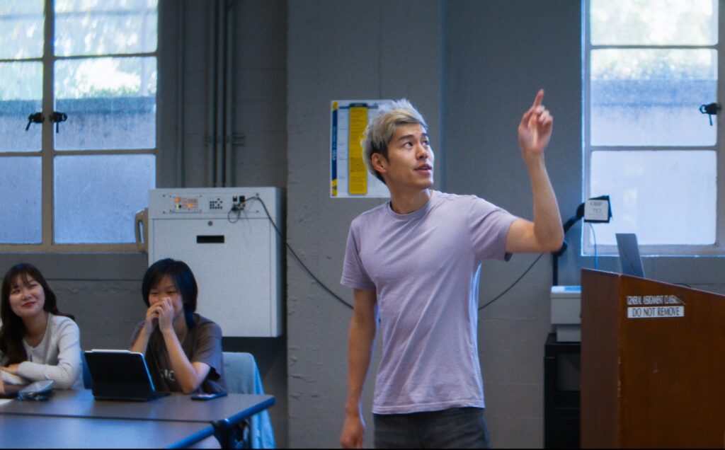 Instructor pointing to a whiteboard