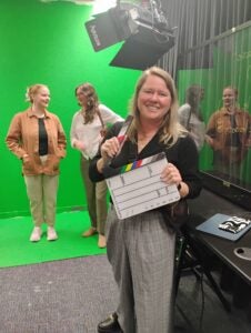 Employee on a green screen set