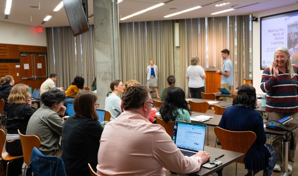 Photo of classroom with attendees on lap tops