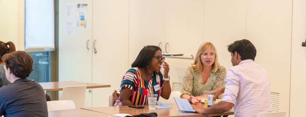 Photo of Graduate students at a table