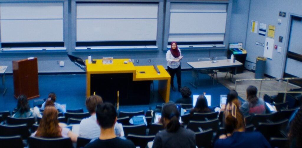 Photo of instructor in a classroom with students