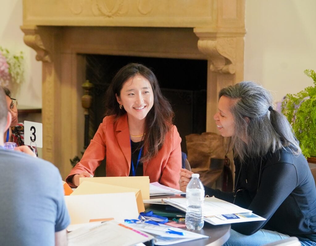Instructors sitting at a table working together