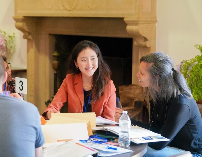 Instructors sitting at a table working together