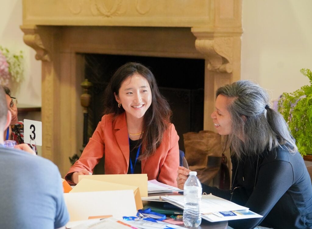Instructors sitting at a table working together