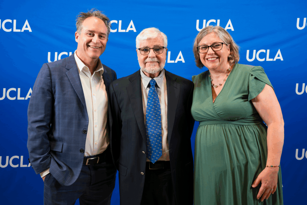 Brian Kite, Mike Levine, and Erin Sanders O'Leary against a blue UCLA background.