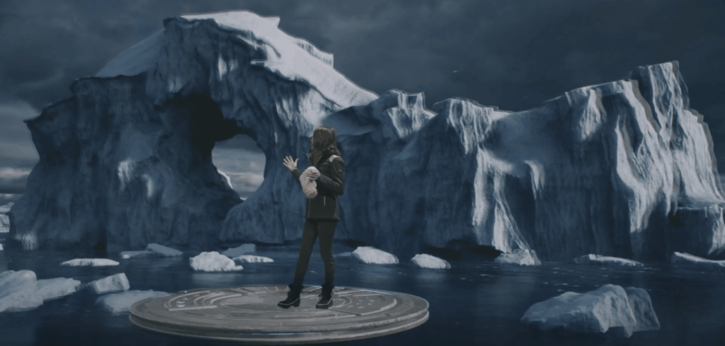 Woman stands in front of a glacier background