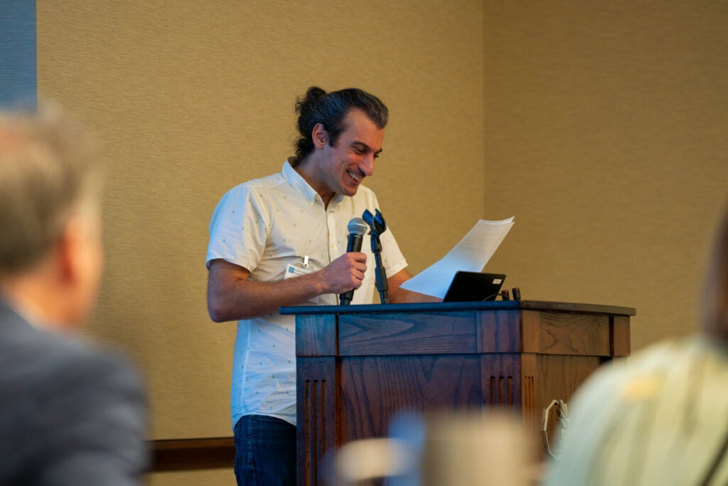 Raffi Joe Wartanian speaks at a podium during the celebration.