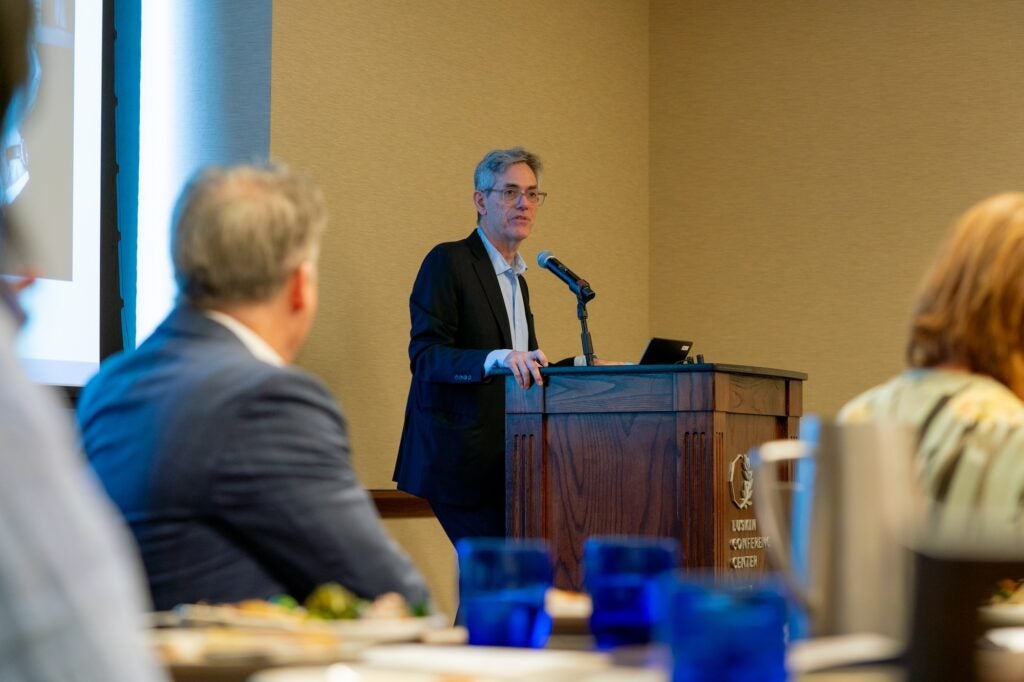 David Myers speaks at a podium during the Celebration event.