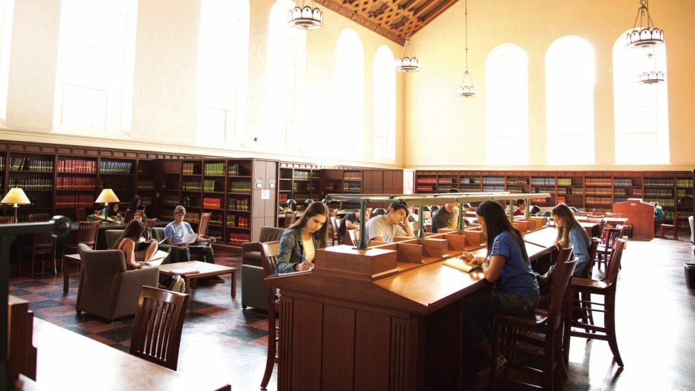 Photo of students studying inside of the Powell library