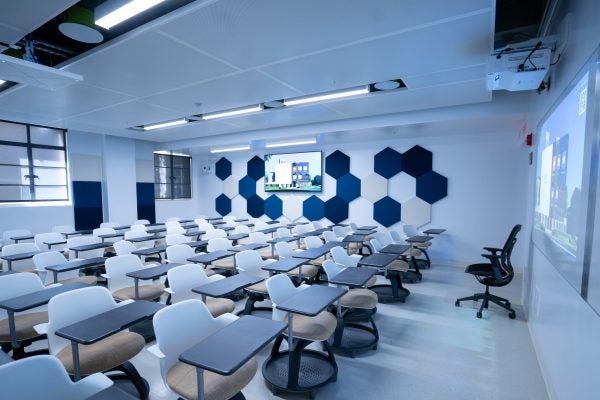 Empty classroom with blue and white chairs and walls
