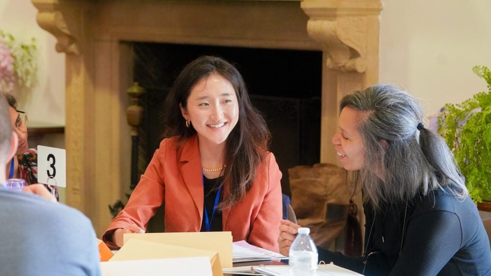 Instructors sitting at a table working together