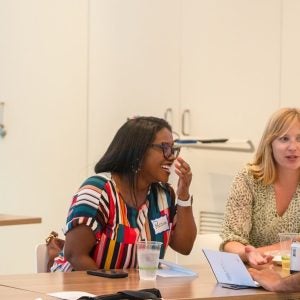 Photo of Graduate students at a table