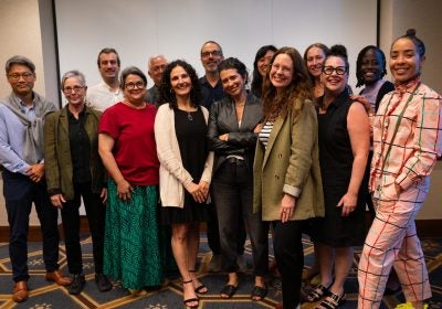 Dialogue across Difference (DaD) Faculty Fellows program participants stand smiling towards the camera.