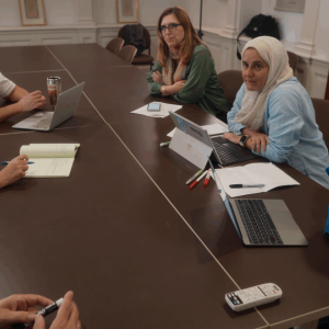 Photo of HET cohort working at a table