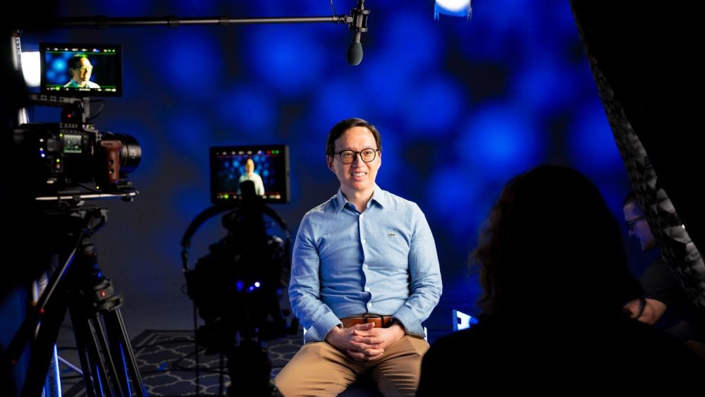 Distinguished Teaching Award recipient Edward Ha being filmed on a TLC set.